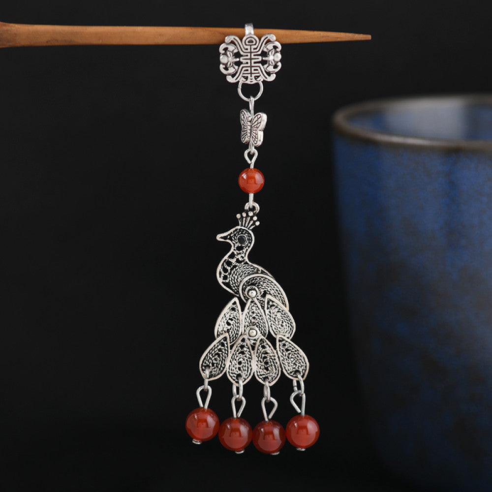 Boho vintage ethnic silver hair stick featuring a peacock and bell charms, styled on a stick, ideal for bohemian and traditional fashion enthusiasts in the US 02