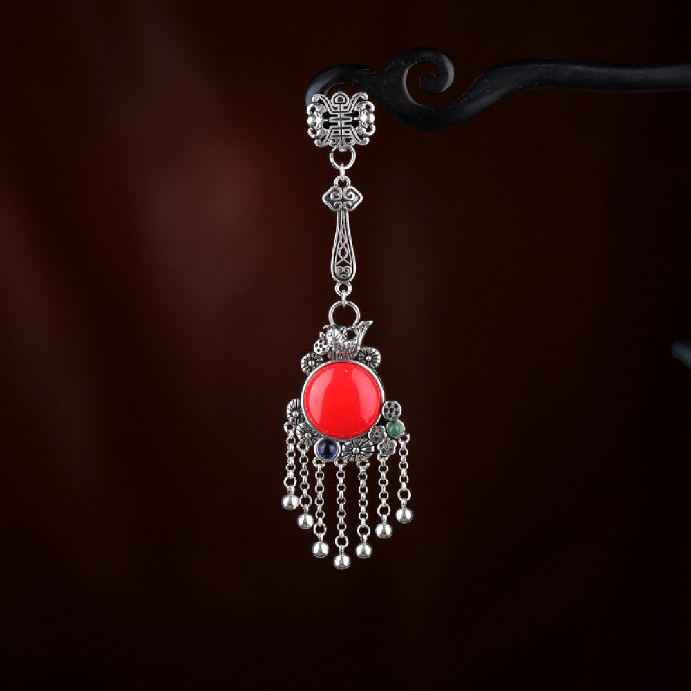 Boho vintage ethnic silver hair pendant charm with red gemstone and tassel details, styled on a display hook, ideal for bohemian and traditional fashion enthusiasts in the US
