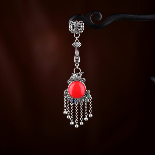 Boho vintage ethnic silver hair pendant charm with red gemstone and tassel details, styled on a display hook, ideal for bohemian and traditional fashion enthusiasts in the US