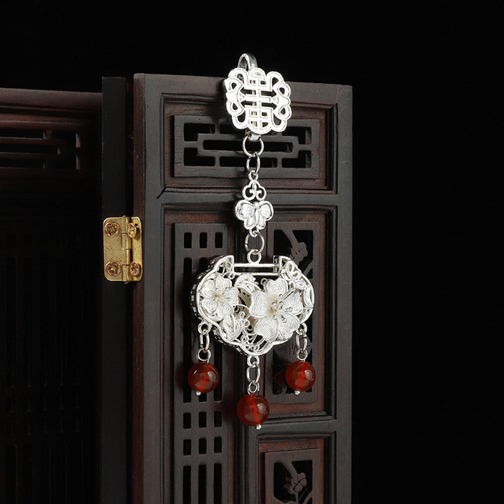 Boho vintage ethnic silver hair pendant featuring Chinese knot, intricate lantern charm and red bead details, styled on a wooden display hook, ideal for bohemian and traditional fashion enthusiasts in the US 03