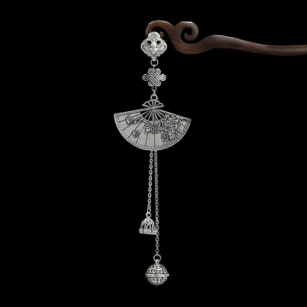 Boho vintage ethnic silver hair pendant featuring fan-shaped openwork charm, decorative tassel details, styled on a wooden display hook, ideal for bohemian and traditional fashion enthusiasts in the US