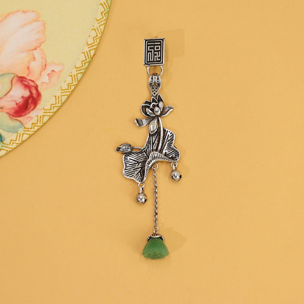 Boho vintage ethnic silver hair pendant featuring fu character detail, opera character-shaped charm and green tassel, styled on a wooden display hook, ideal for bohemian and traditional fashion enthusiasts in the US 03