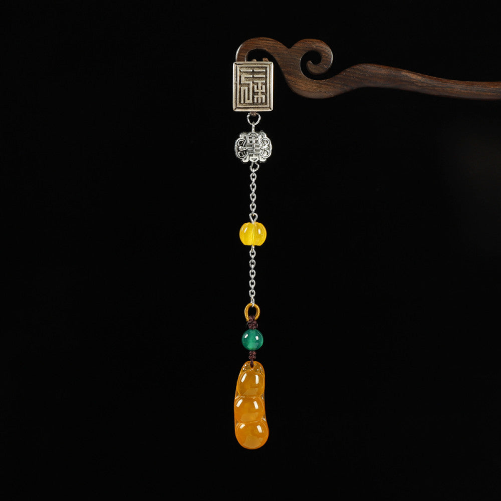 Boho vintage ethnic silver hair pendant featuring Fu character detail, yellow/red bead accents, and a jade bean-shaped charm, styled on a wooden display hook against a black background, ideal for bohemian and traditional fashion enthusiasts in the US 02