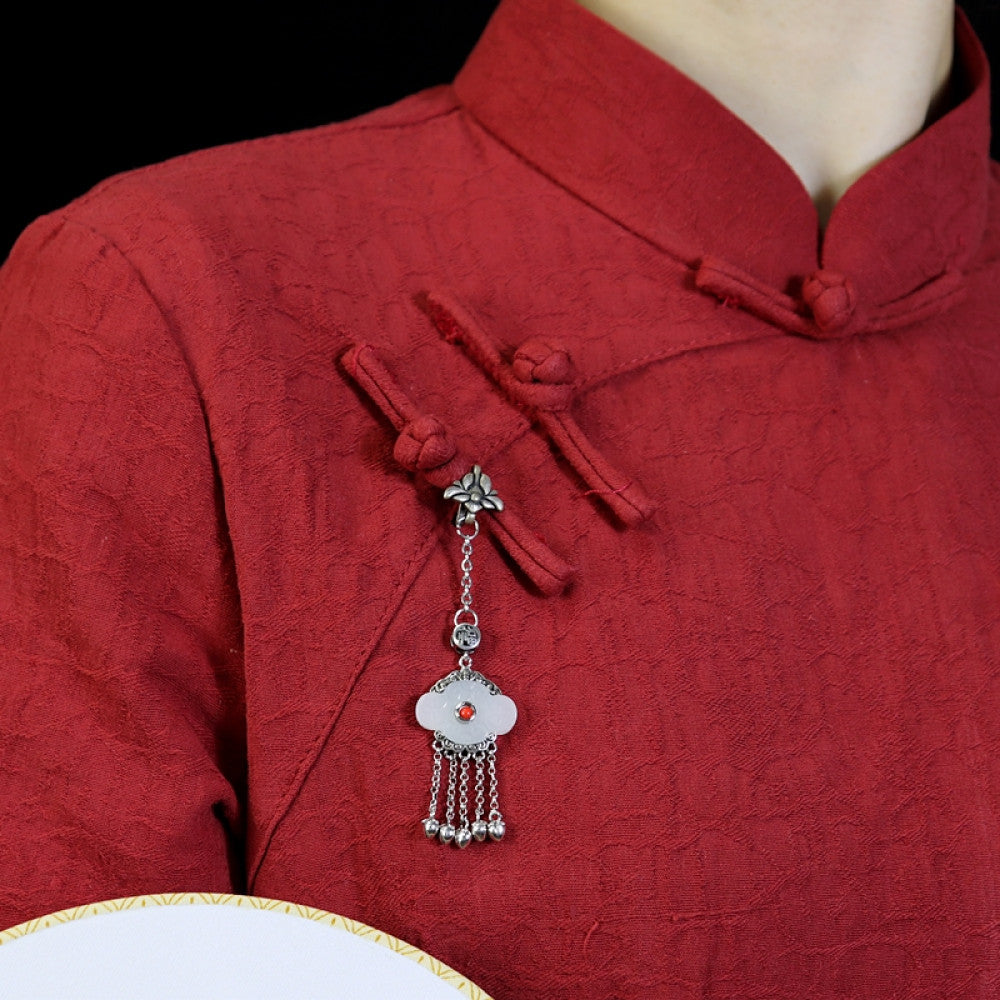 Boho vintage ethnic silver hair pendant featuring red gemstone center, clover-shaped white charm and silver tassel details, styled on a woo 02