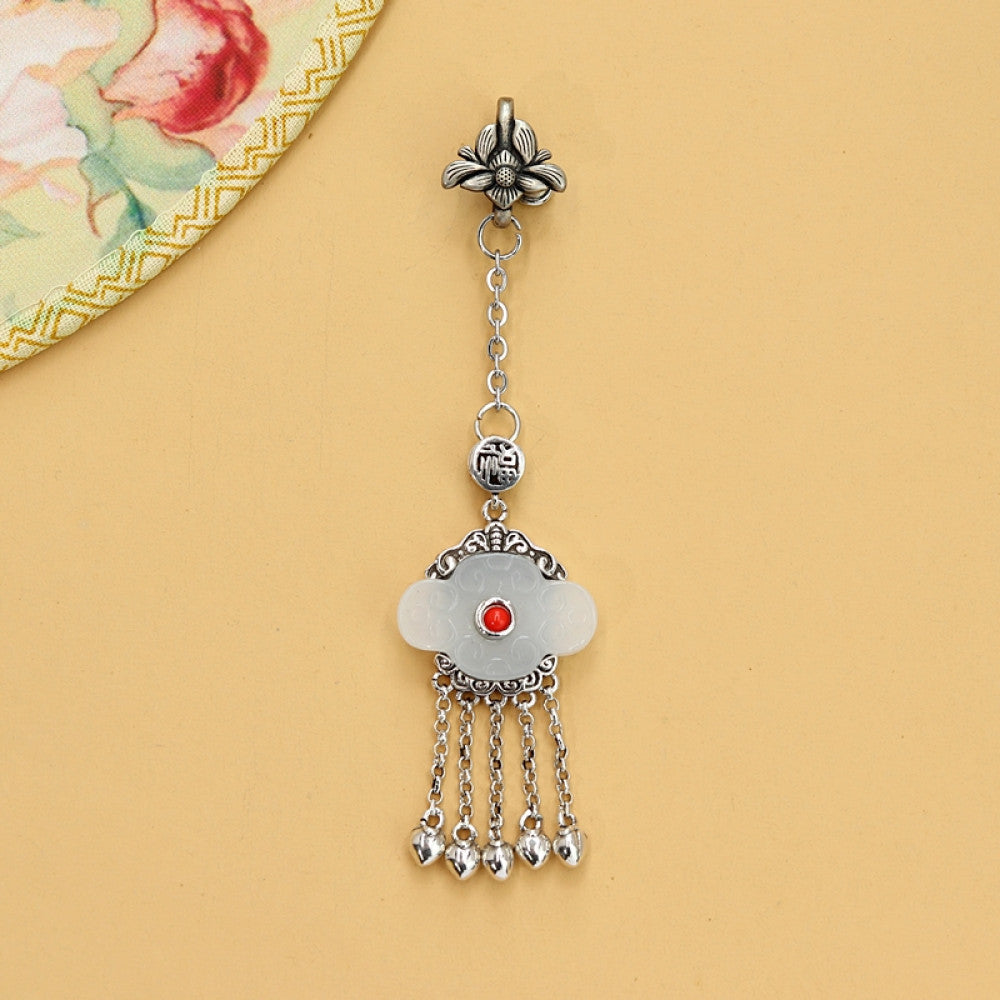 Boho vintage ethnic silver hair pendant featuring red gemstone center, clover-shaped white charm and silver tassel details, styled on a woo 03