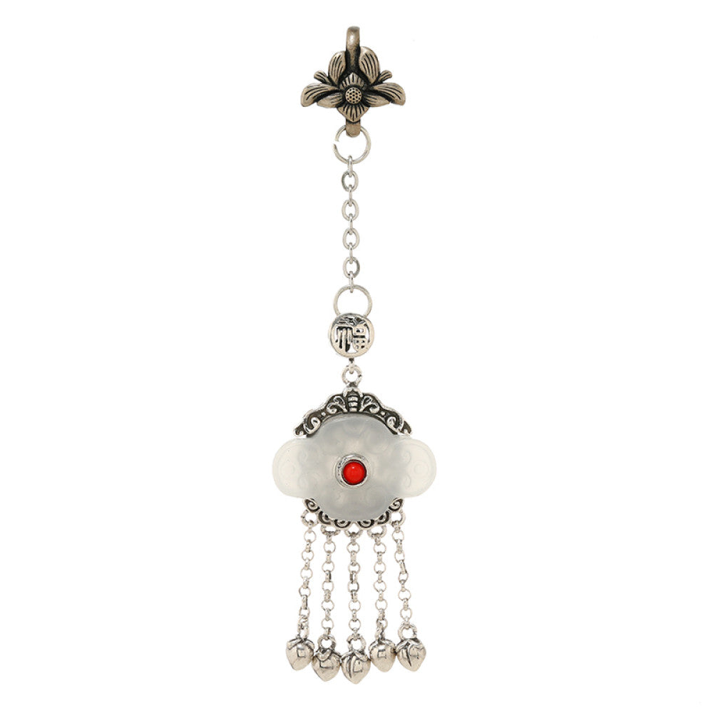 Boho vintage ethnic silver hair pendant featuring red gemstone center, clover-shaped white charm and silver tassel details, styled on a woo 04