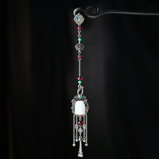 Boho vintage ethnic silver statement pendant with colorful beads, white gemstone center and tassel details, styled on a display hook, ideal for bohemian and traditional fashion enthusiasts in the US
