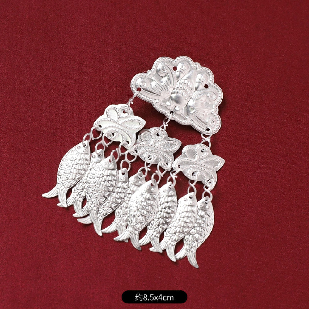 Boho vintage ethnic silver-tone decorative brooch/ornament (displayed on a rich red velvet background) featuring butterfly & lotus details, plus fish-shaped and pearl tassel pendants, ideal for bohemian retro or traditional fashion styling in the US 01