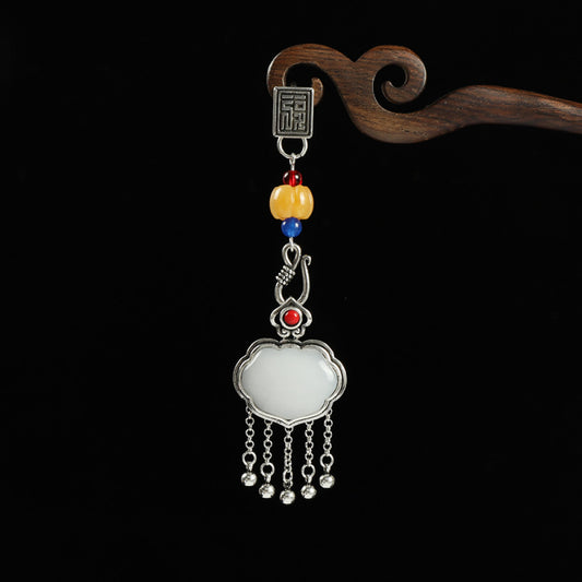 Boho vintage ethnic silver-tone hair pendant featuring Fu character detail, yellow/blue bead accents, red gemstone decoration, white lock-shaped pendant and silver tassel details, styled on a wooden display hook against a black background, ideal for bohemian and traditional fashion enthusiasts in the US