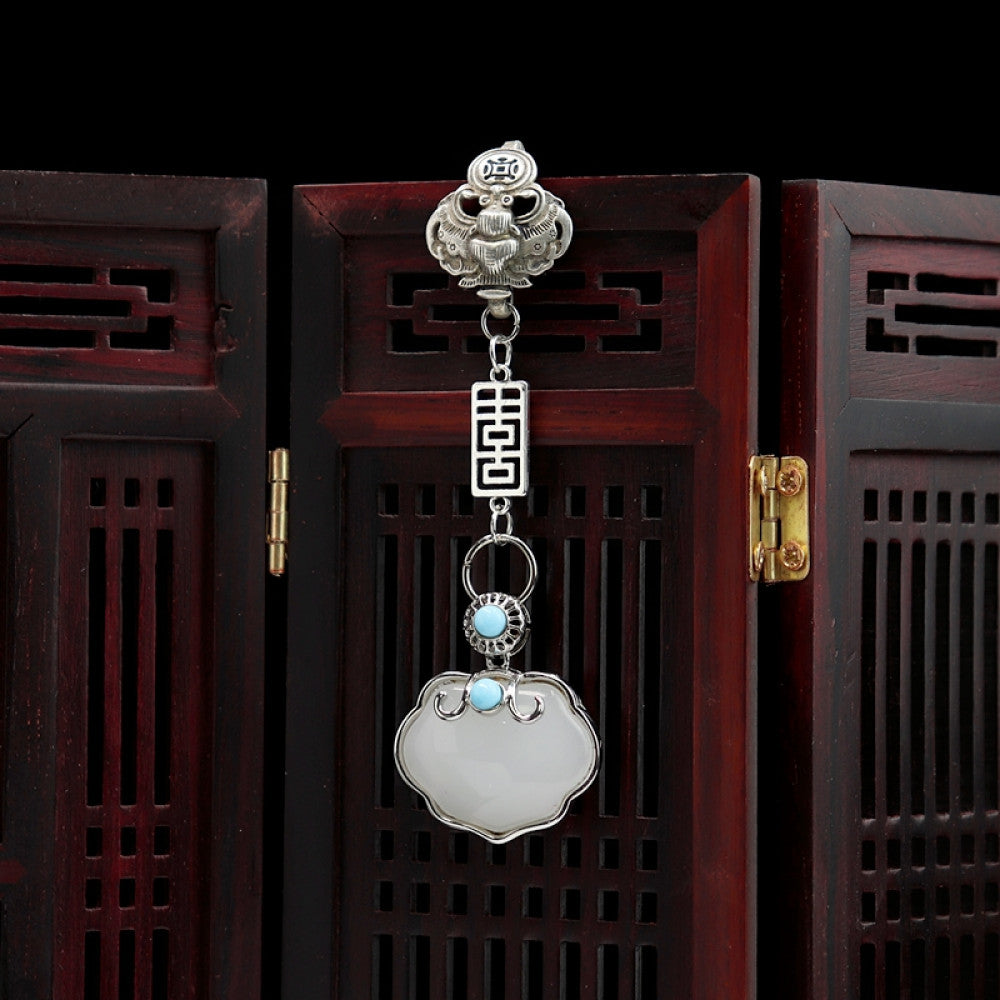 Boho vintage ethnic silver-tone hair pendant featuring lion-shaped decorative clasp, double happiness character detail, light blue bead accent, and a white lock-shaped pendant, styled on a wooden display hook against a black background, ideal for bohemian and traditional fashion enthusiasts in the US 03