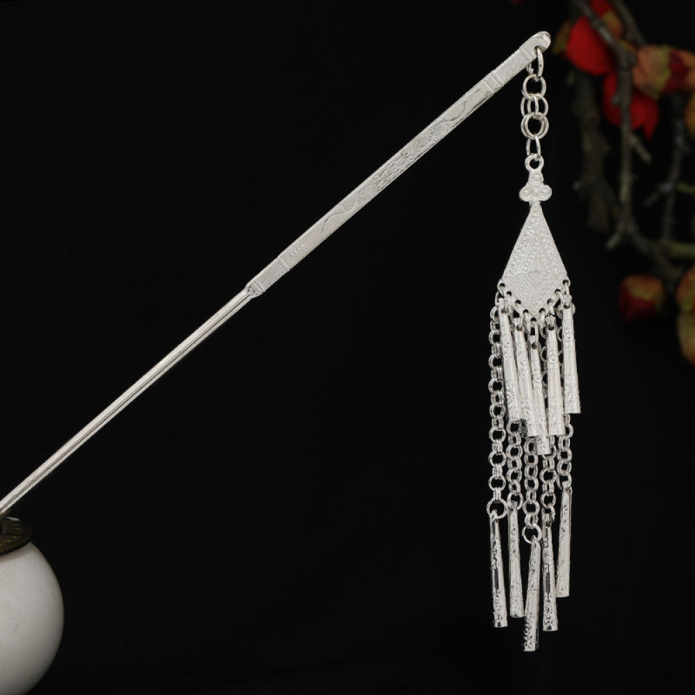 Boho vintage ethnic silver-tone hair stick featuring detailed textured handle, intricate chain network decor, and layered silver tassel pendants, displayed against a black background with red floral accents 03
