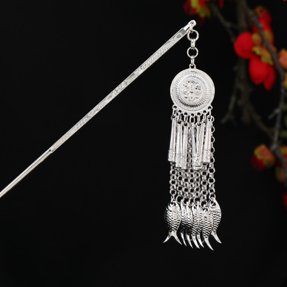 Boho vintage ethnic silver-tone hair stick featuring detailed textured handle, intricate chain network decor, and layered silver tassel pendants, displayed against a black background with red floral accents 19