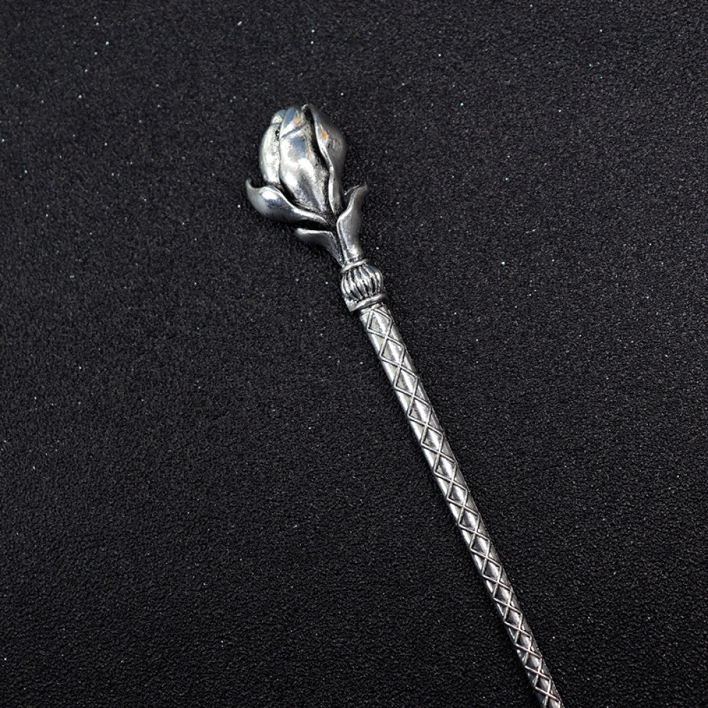Boho vintage ethnic silver tone hair stick featuring a detailed flower cluster top and ornate carved pattern handle, displayed on a black glittery fabric background 05