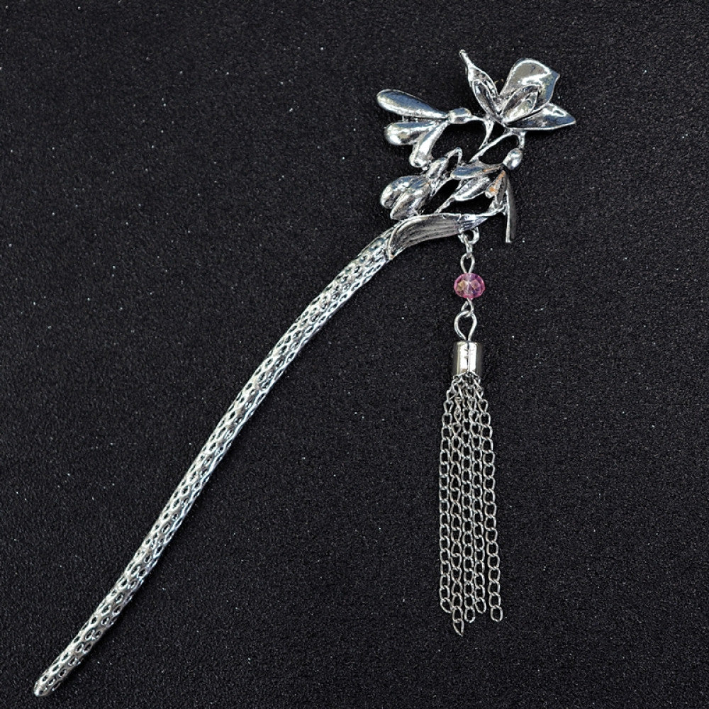 Boho vintage ethnic silver tone hair stick featuring a detailed flower cluster top and ornate carved pattern handle, displayed on a black glittery fabric background 08