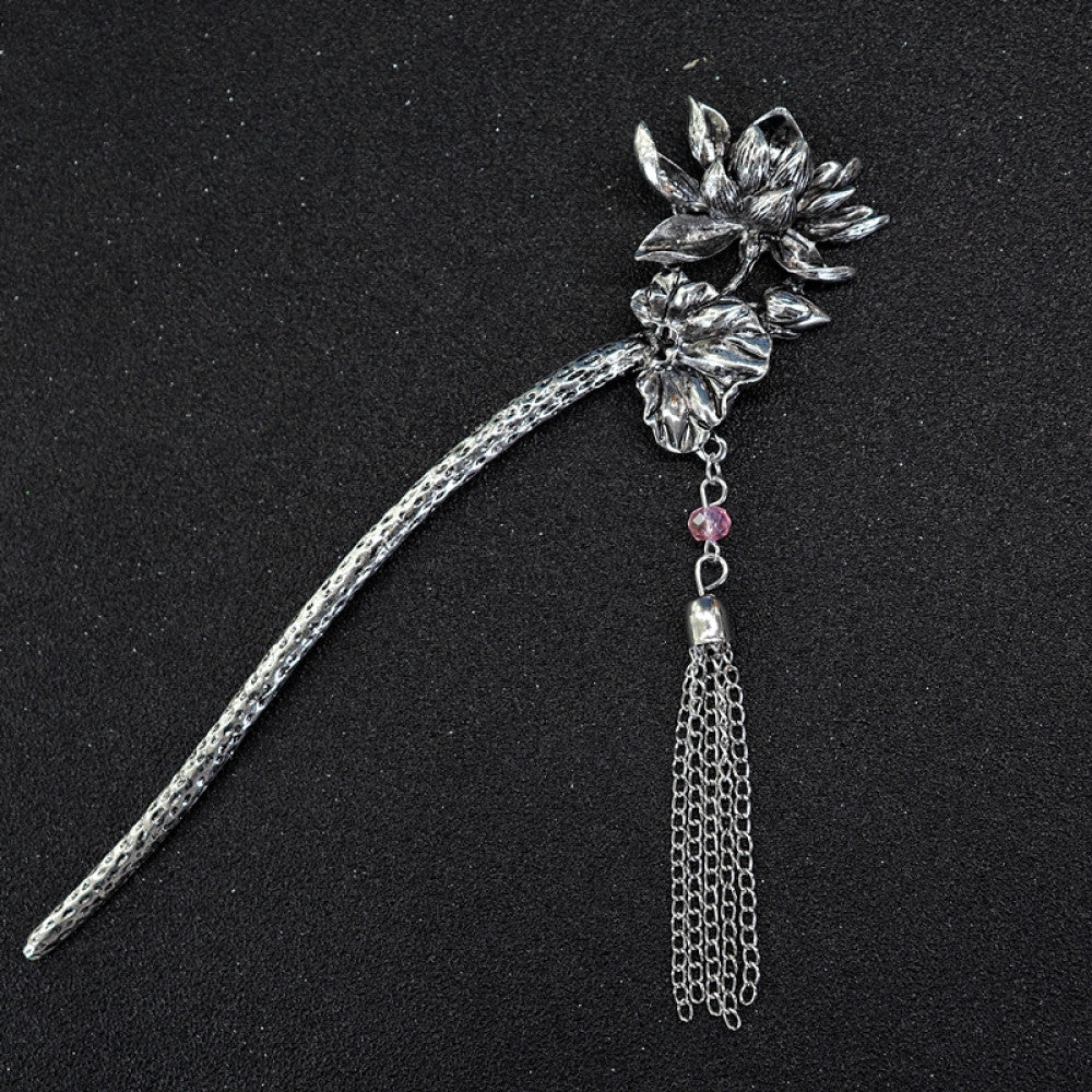 Boho vintage ethnic silver tone hair stick featuring a detailed flower cluster top and ornate carved pattern handle, displayed on a black glittery fabric background 09