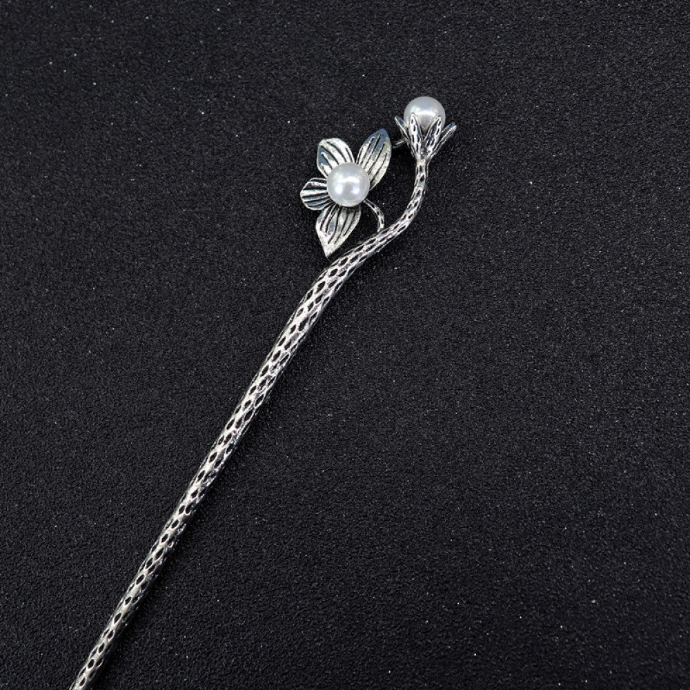 Boho vintage ethnic silver tone hair stick featuring a detailed flower cluster top and ornate carved pattern handle, displayed on a black glittery fabric background, ideal for bohemian and traditional fashion enthusiasts in the US 03