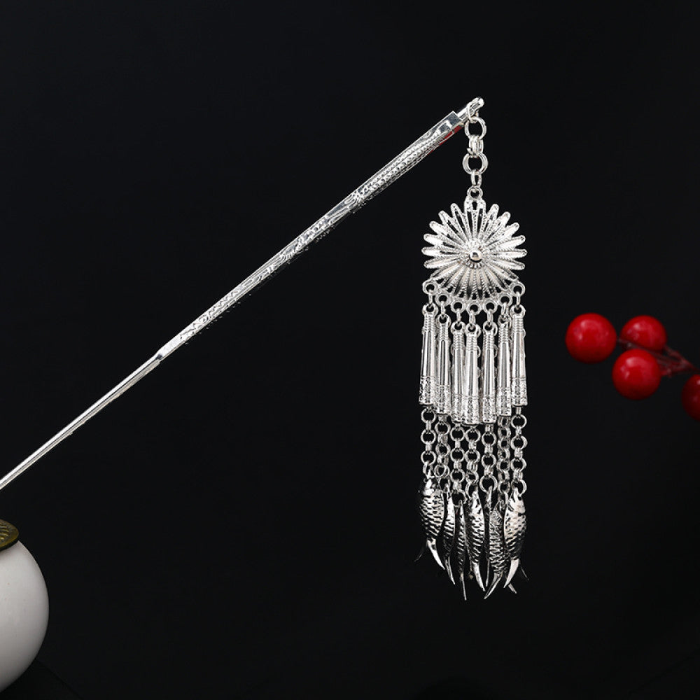 Boho vintage ethnic silver-tone hair stick featuring an intricate rooster-shaped charm, detailed decorative accents, and layered silver tassel pendants, displayed against a black background with red floral decor, 07