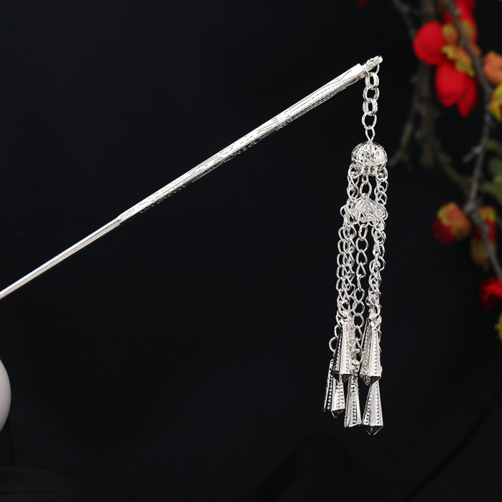 Boho vintage ethnic silver-tone hair stick featuring an intricate rooster-shaped charm, detailed decorative accents, and layered silver tassel pendants, displayed against a black background with red floral decor 09