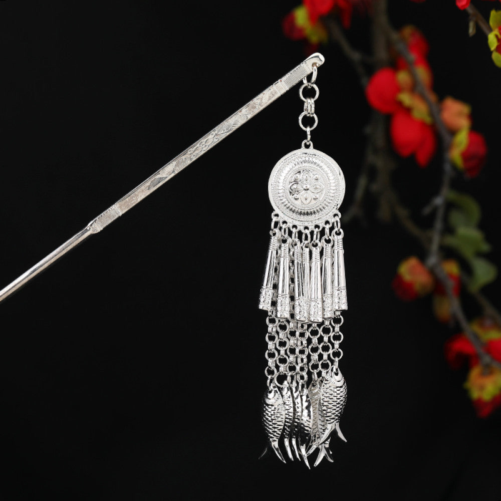 Boho vintage ethnic silver-tone hair stick featuring an intricate rooster-shaped charm, detailed decorative accents, and layered silver tassel pendants, displayed against a black background with red floral decor 11