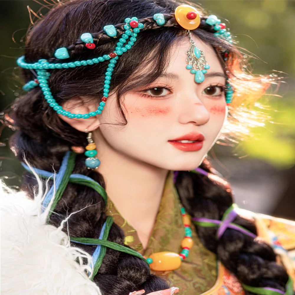 Boho vintage ethnic traditional hair jewelry set (turquoise beads headpiece, ornate forehead chain, layered multi-color bead earrings) styled with braided hair & ethnic costume, displayed in outdoor natural light