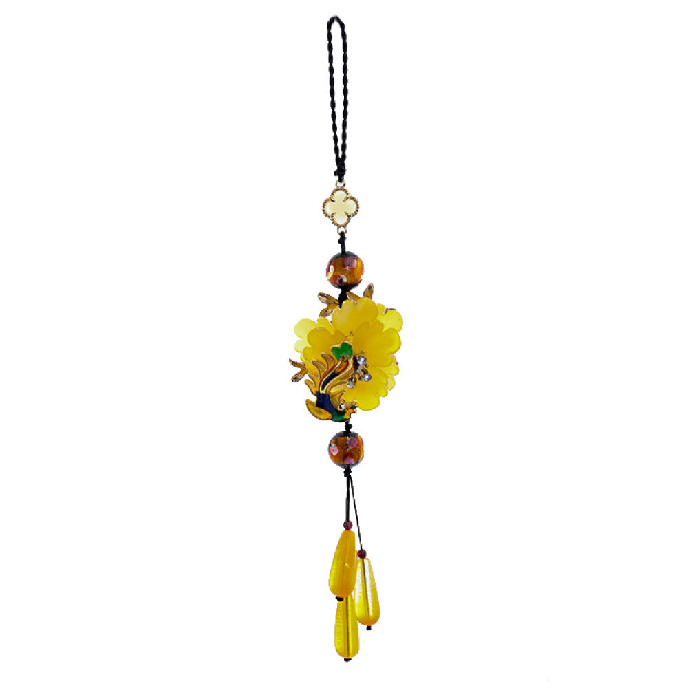 Boho vintage ethnic yellow-tone hair pendant featuring black cord, yellow flower-shaped charm (with multi-color gemstone & gold accents), and yellow teardrop pendants, styled against a black fabric background, ideal for bohemian and traditional fashion enthusiasts in the US 04