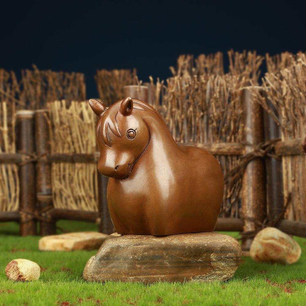 Charming bronze bunny statue with a rounded design, set against a rustic bamboo fence backdrop, a Feng Shui symbol of good fortune, ideal as whimsical home decor 02