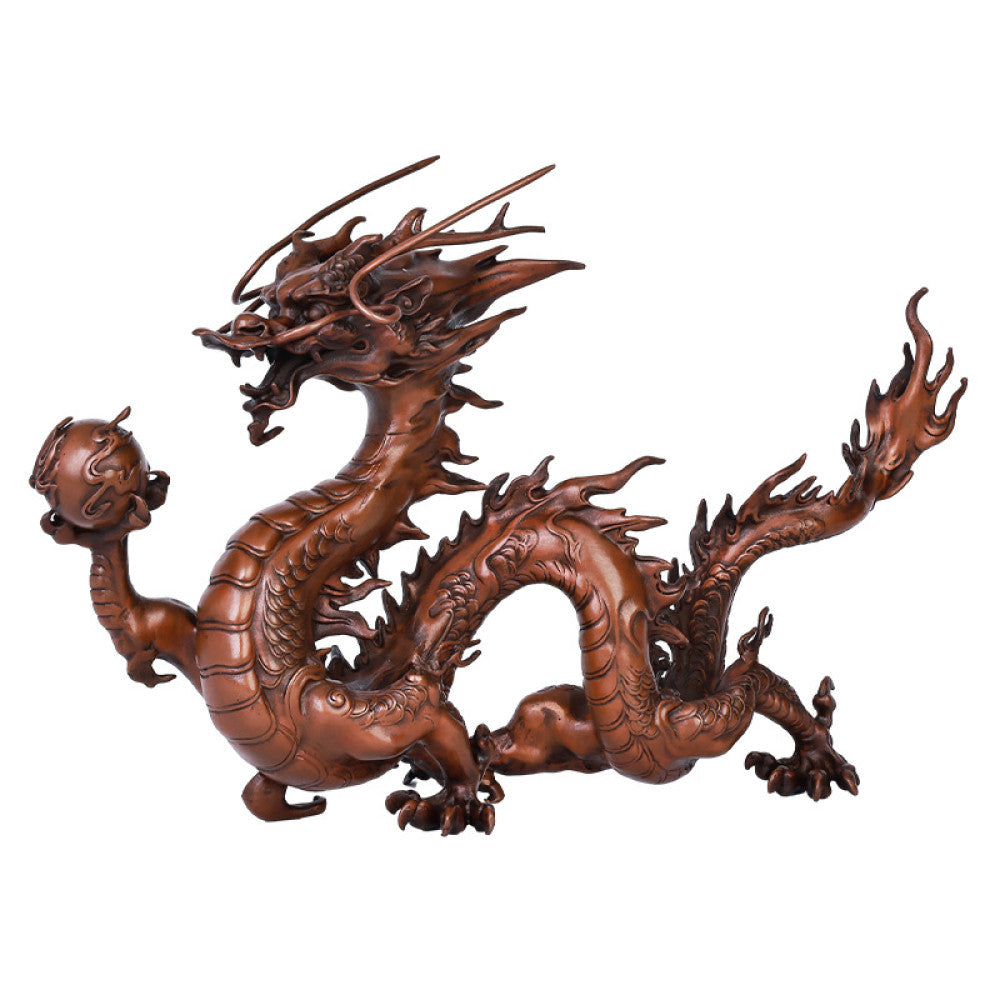 Intricate bronze Chinese dragon statue holding a pearl, a Feng Shui symbol of good fortune and strength, displayed as elegant home decor in a natural-inspired setting against a green background 04