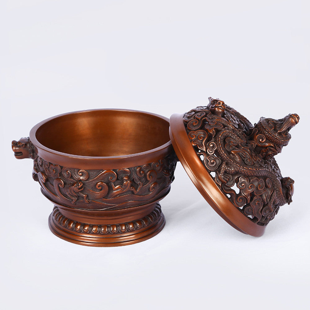 Intricate bronze Chinese incense burner with dragon-topped pierced lid, beast-head handles, and wave motifs, a Feng Shui symbol of wealth and protection, displayed as elegant home decor against a white background 05