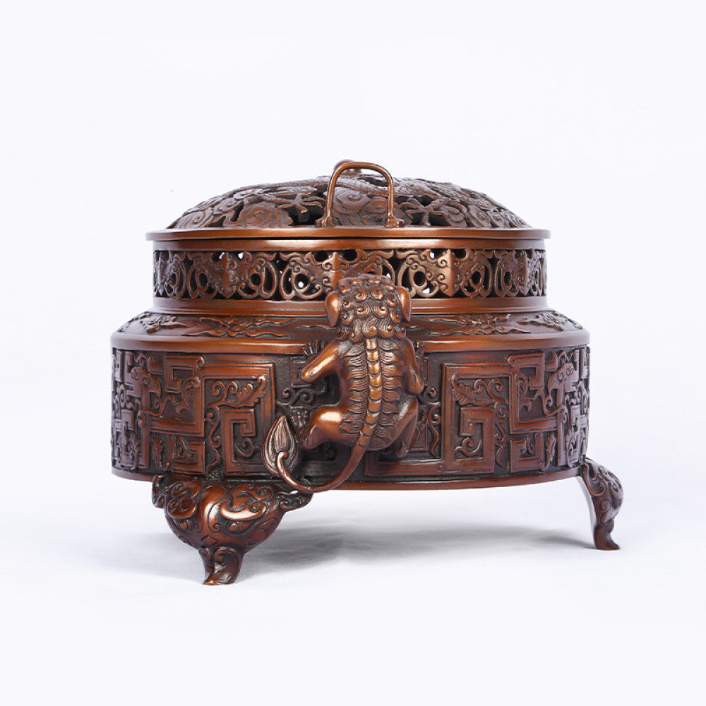 Intricate bronze Chinese incense burner with detailed beast handles, elaborate carvings, and a pierced lid, a Feng Shui symbol of wealth and harmony, displayed as elegant home decor against a white background 03