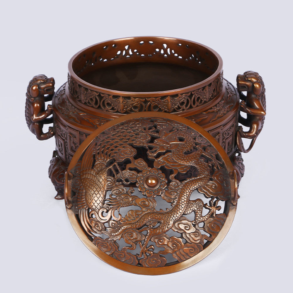 Intricate bronze Chinese incense burner with detailed beast handles, elaborate carvings, and a pierced lid, a Feng Shui symbol of wealth and harmony, displayed as elegant home decor against a white background 04