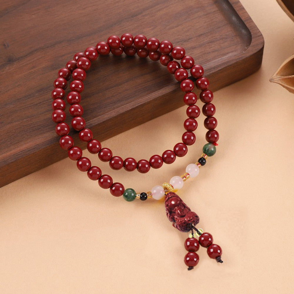 Gradient green crystal beads paired with cinnabar, with a Vajra Bodhi tassel adding a light, breathable feel.