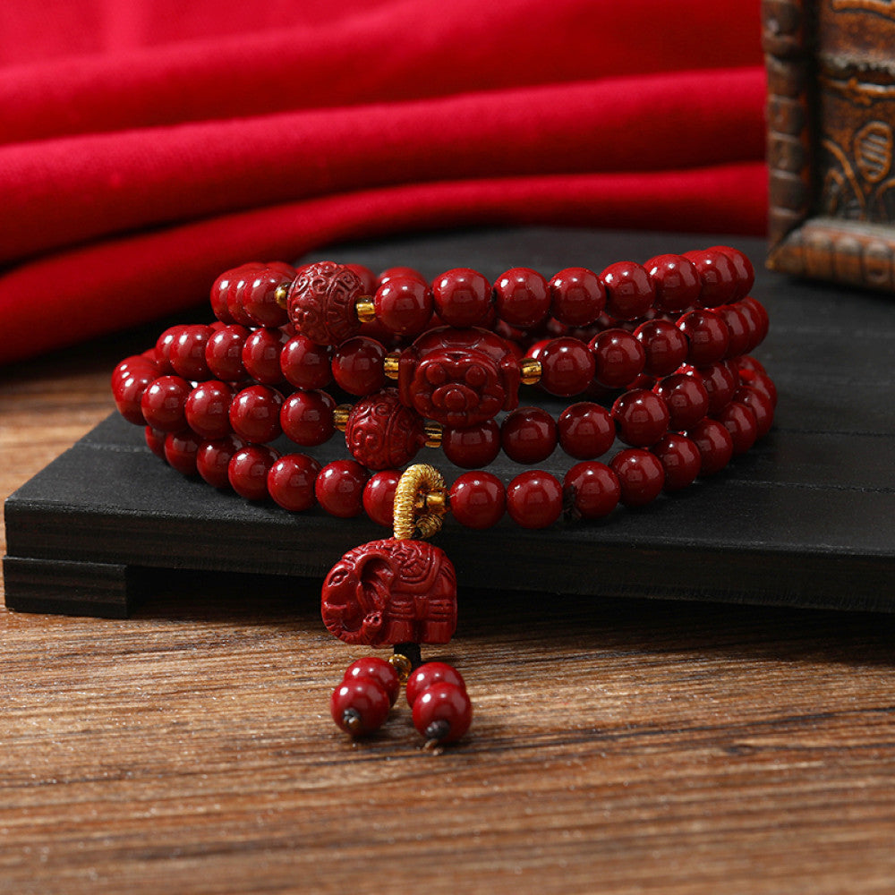 Warm yellow beads complement deep red cinnabar, bright and auspicious.