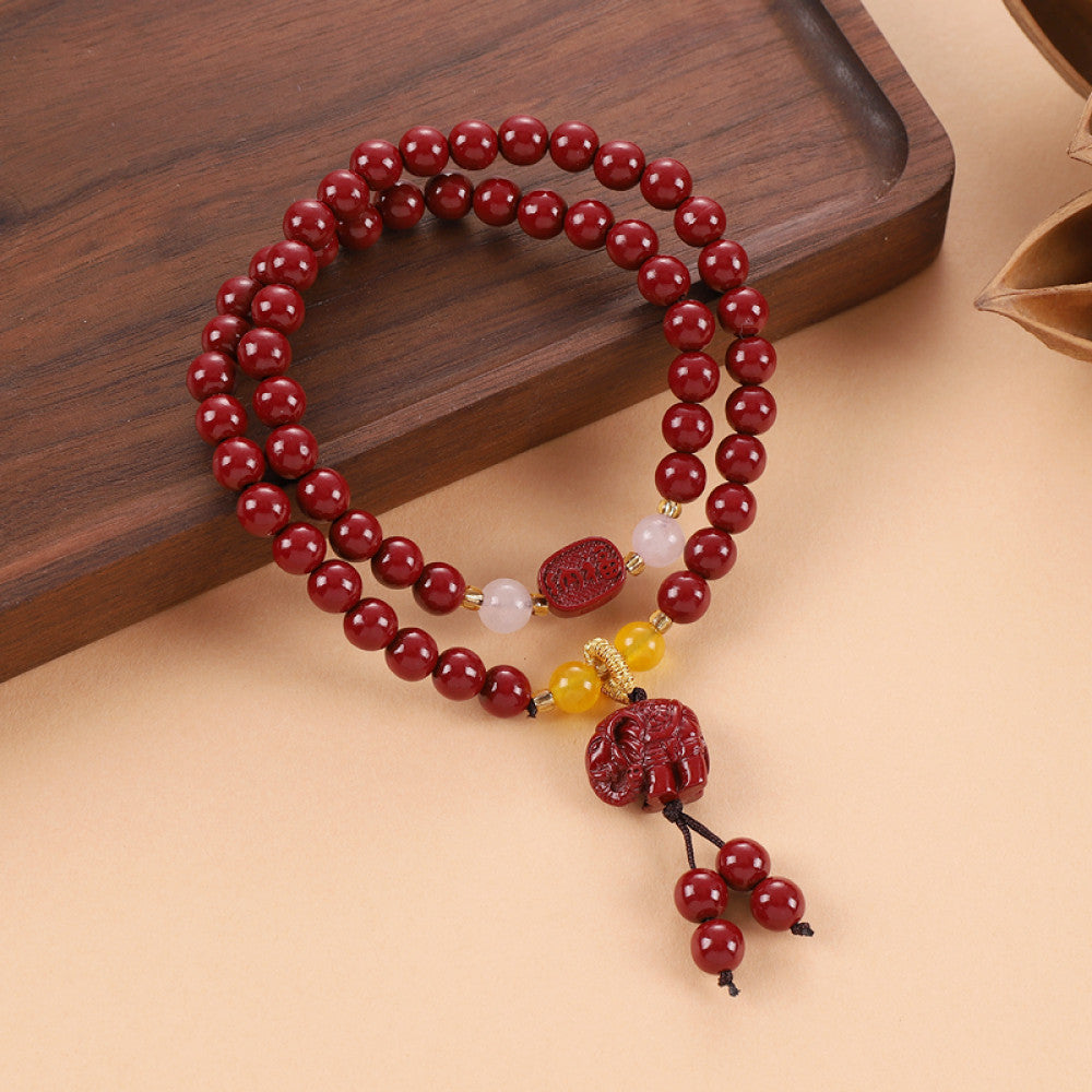 Warm yellow chalcedony accents the cinnabar string, balanced by a Vajra Bodhi pendant for a gentle and noble feel.