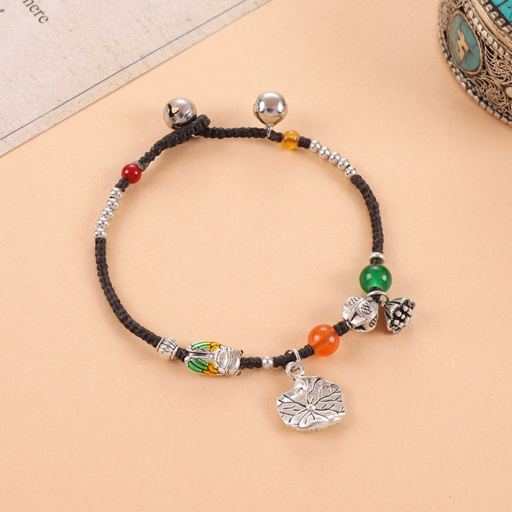 Multicolor beads with rectangular silver tag, playful bohemian look.
