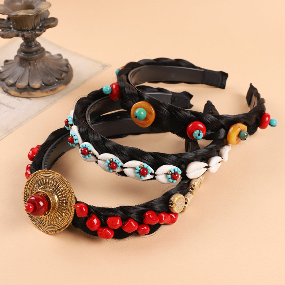 Boho vintage ethnic black braided hair hoop headband featuring a prominent gold ornament, plus red, turquoise, and yellow bead details 01