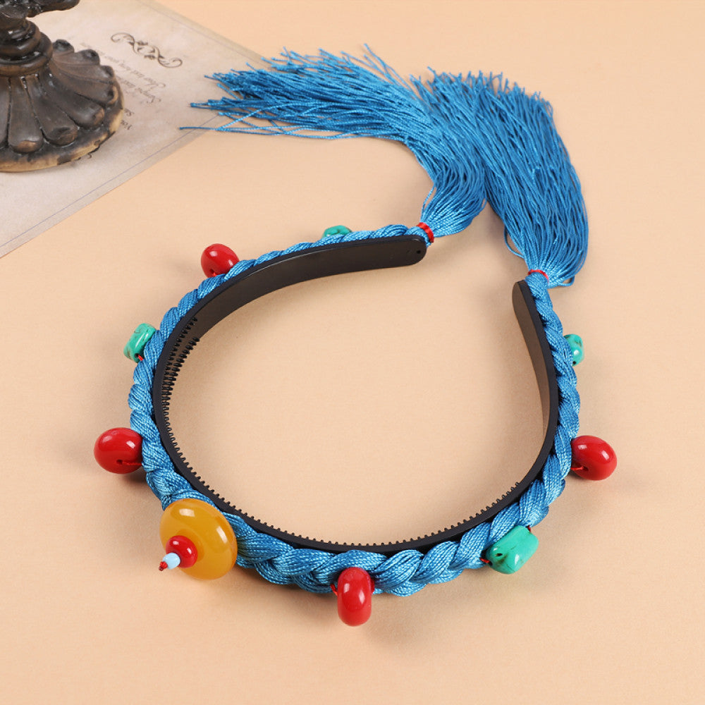 ethnic black braided hair hoop headband featuring red beads, turquoise decorative pieces