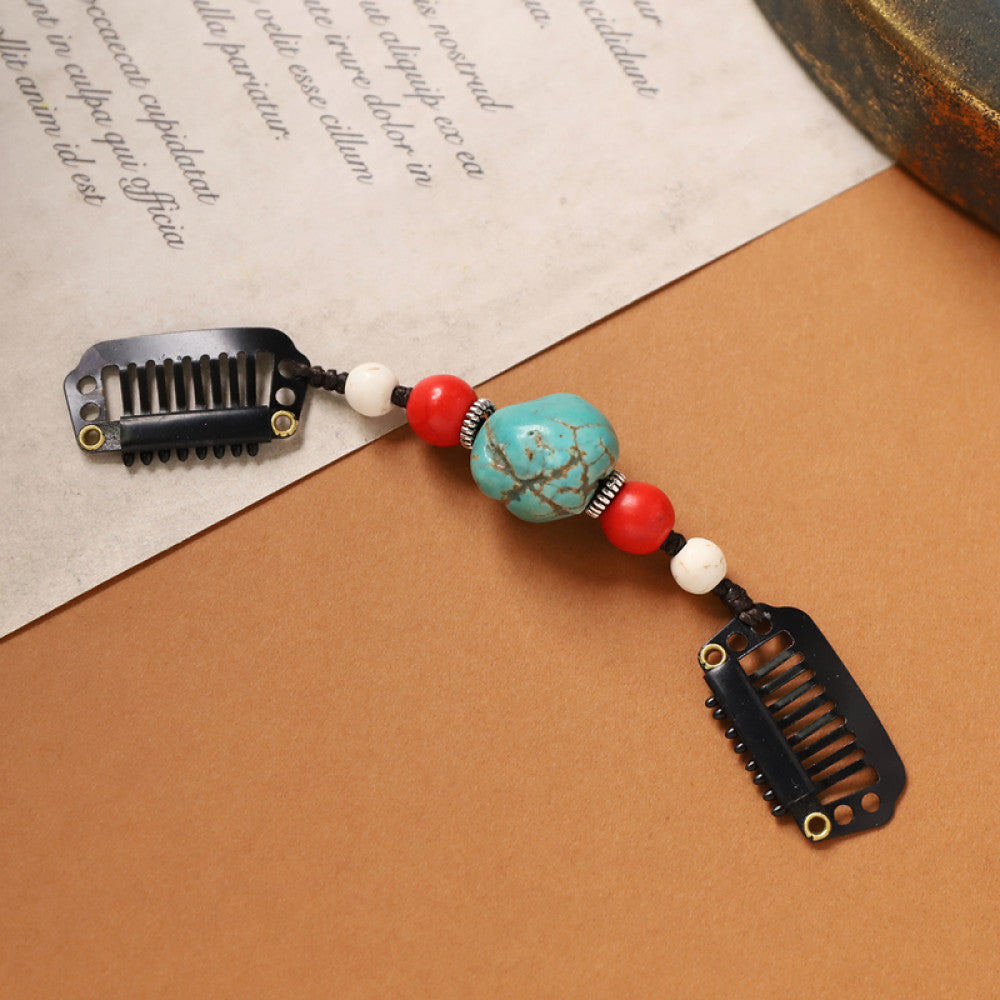 Boho vintage ethnic double hair comb ornament featuring an evil eye decorative bead, red/yellow beads, and black hair combs 01