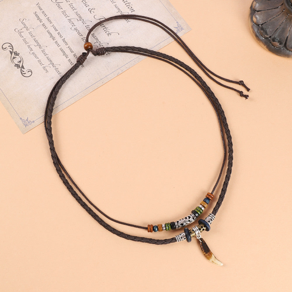 ethnic double-layer leather cord choker necklace featuring mixed colorful beads, a turquoise accent piece, and a small decorative pendant