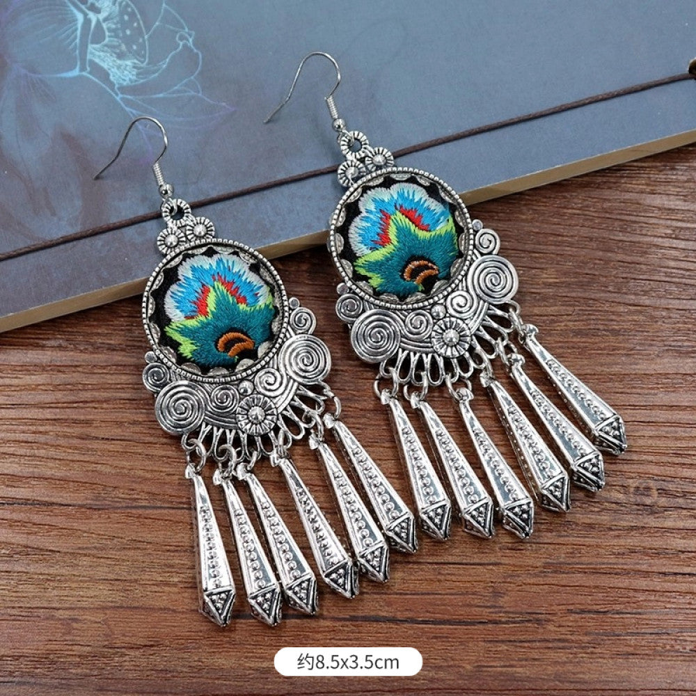 Boho vintage ethnic silver-tone earrings set featuring embroidered lotus details and layered silver bell fringe pendants 01