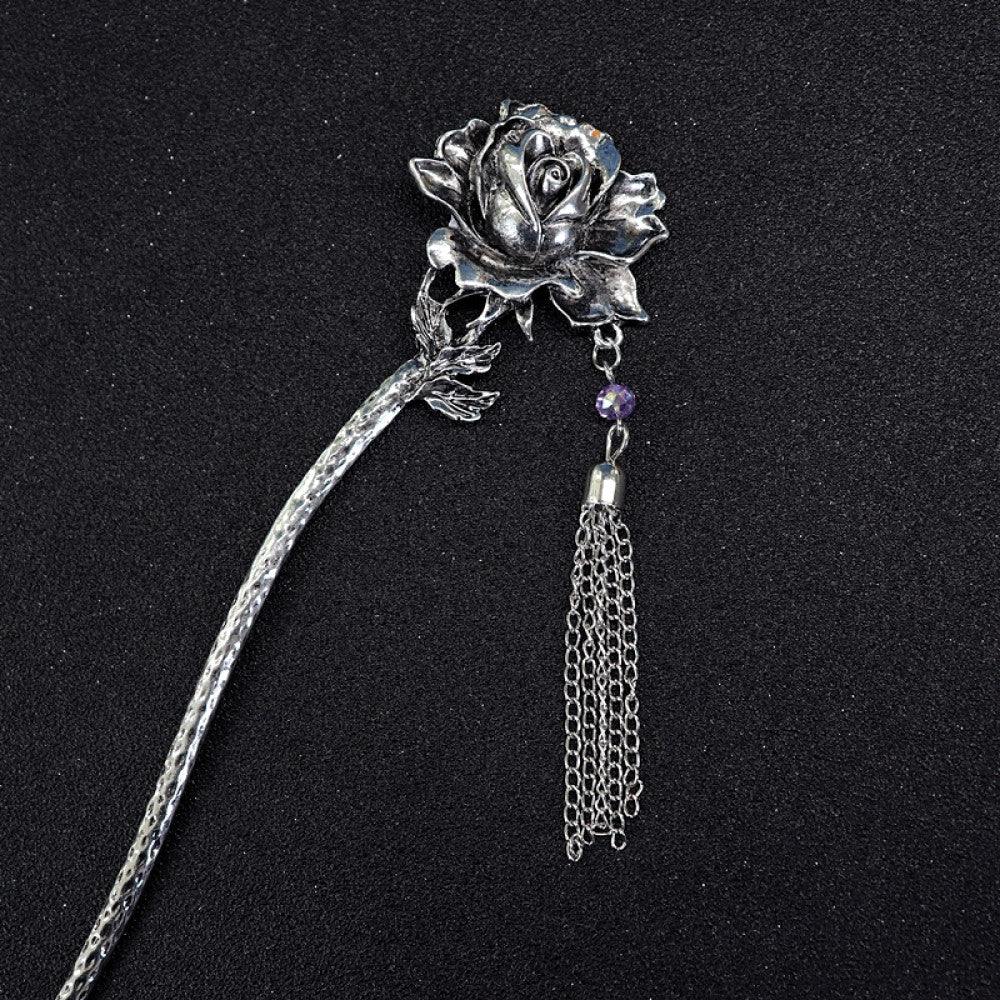 ethnic silver tone hair stick featuring a detailed flower cluster top and ornate carved pattern handle, displayed on a black glittery fabric background 02