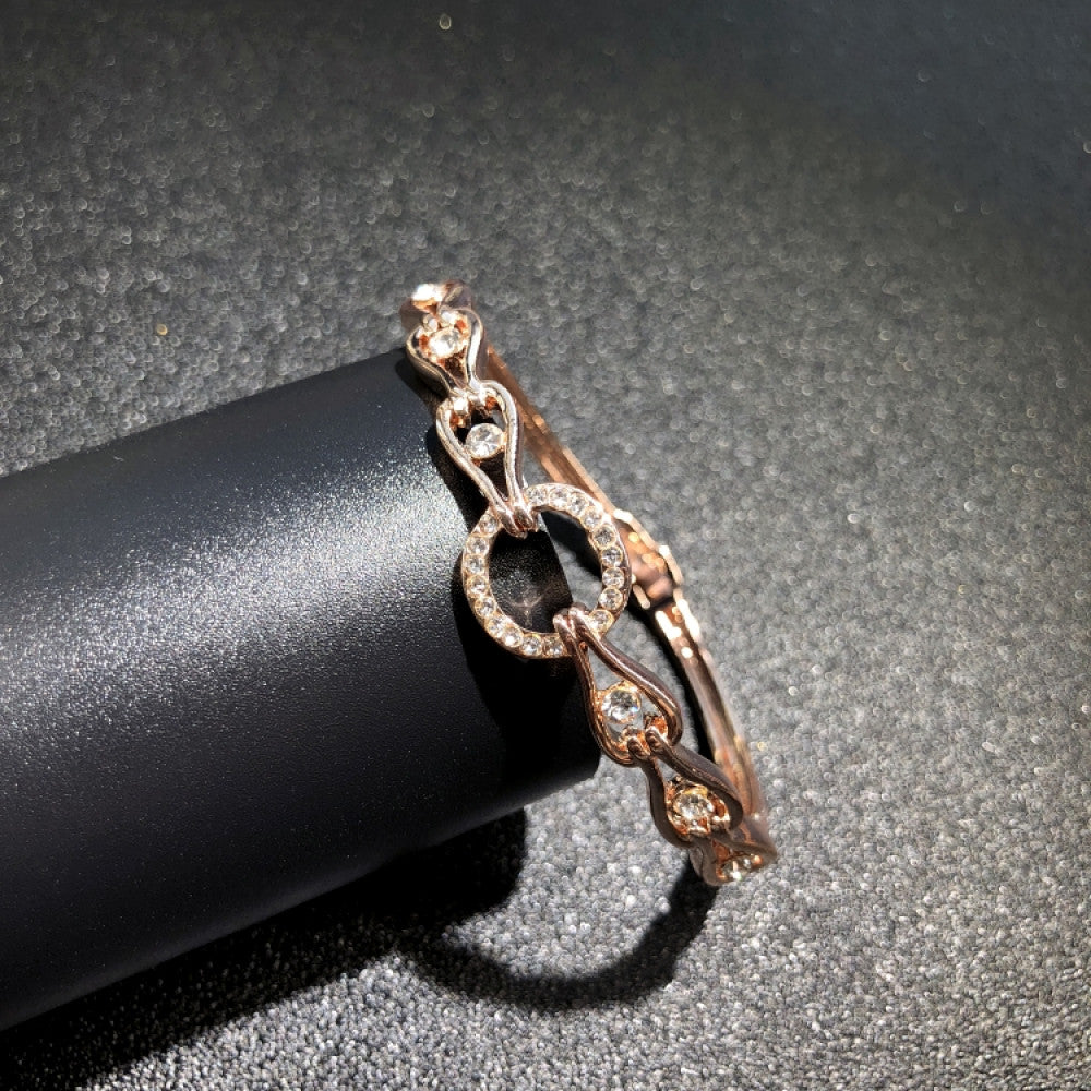 Fashion luxury rose gold bangle with heart-shaped diamond and intricate designs, displayed on black surface, ideal for luxury fashion and special occasion enthusiasts 04