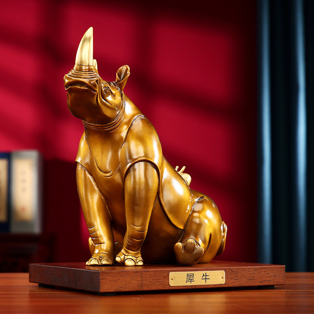 Golden rhino statue with intricate details, a symbol of good luck for home decor, set against a red background 02