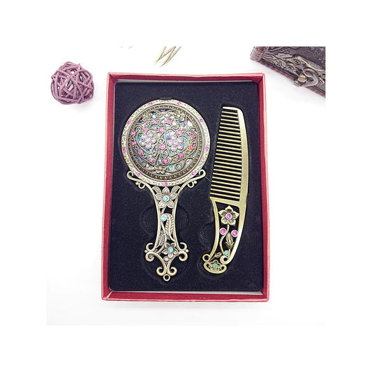 A single handcrafted wooden comb with ornate metal details placed inside a gift box