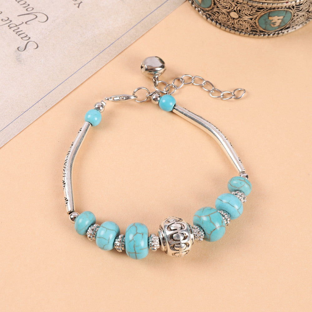 Continuous turquoise bead line, clean and minimalist design.