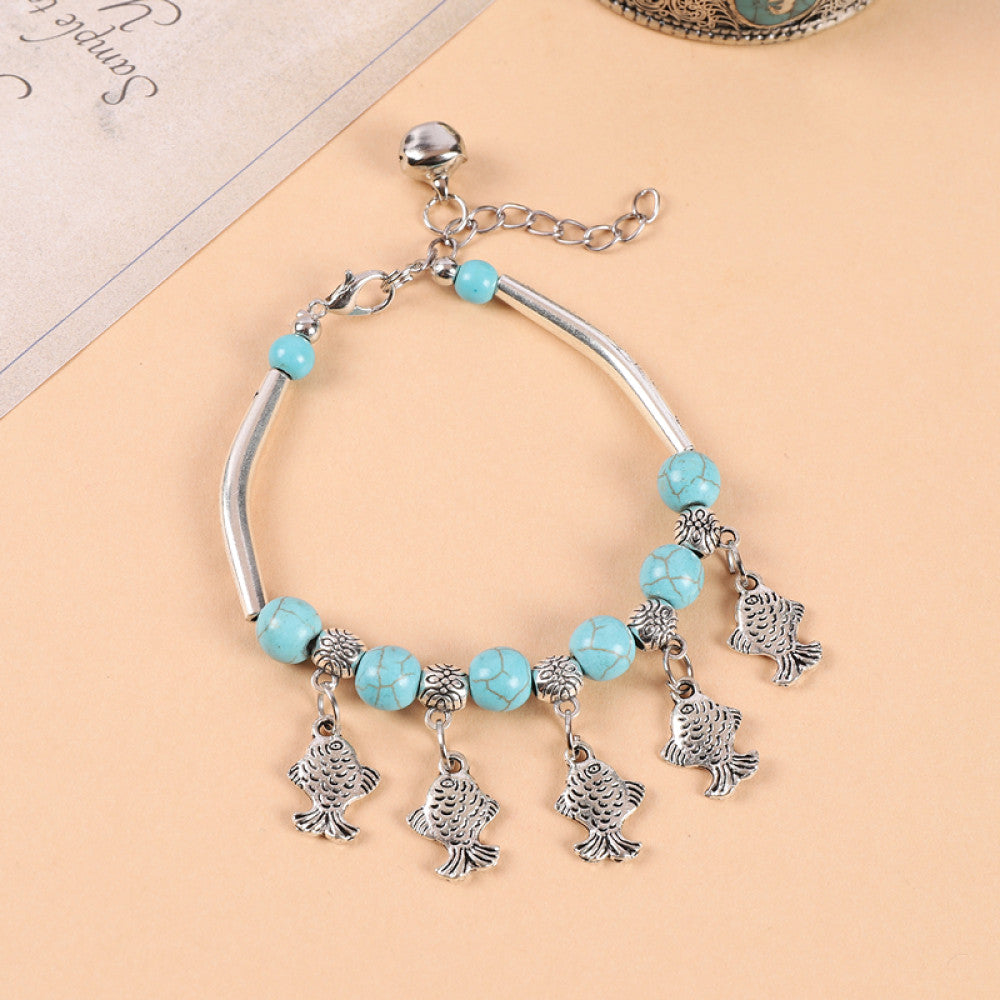 Multiple silver tassel charms with turquoise, boho chic.