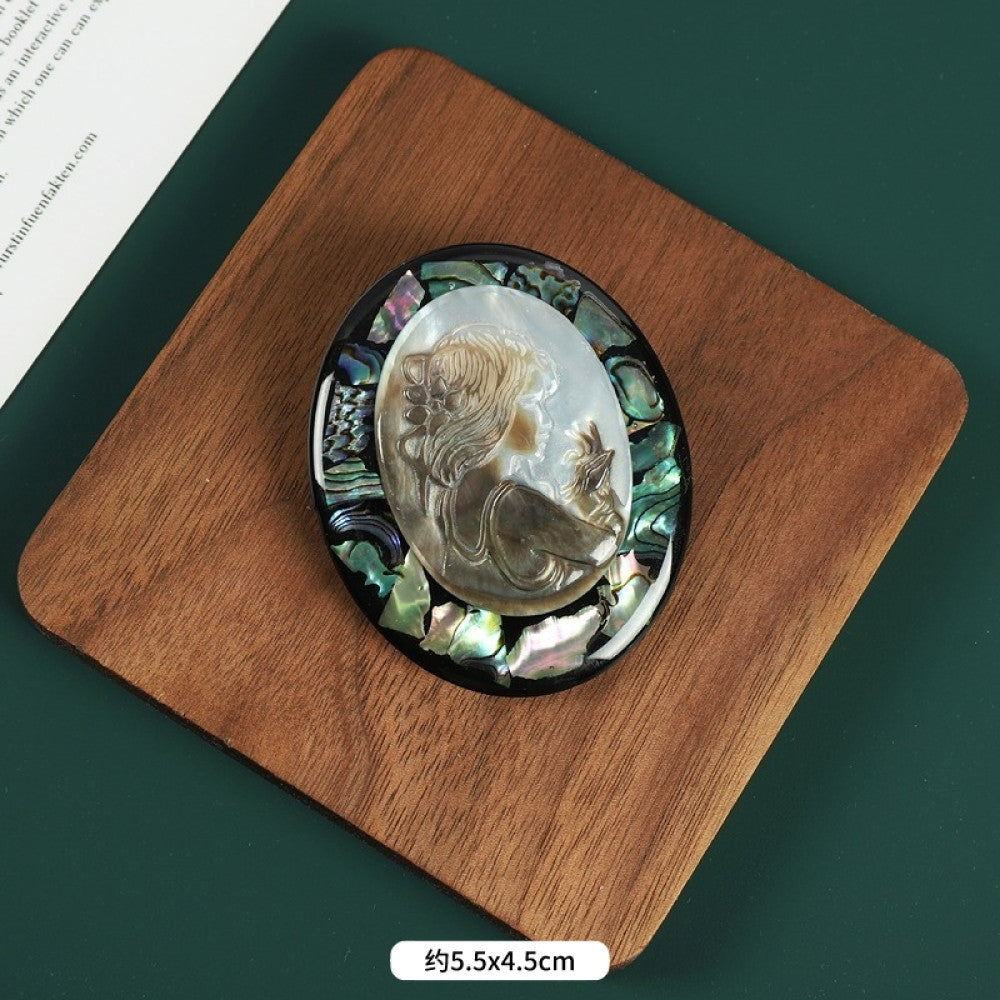 This elegant butterfly brooch is handcrafted from natural mother-of-pearl and iridescent abalone shell, showcasing unique organic patterns. A perfect nature-inspired accessory to elevate any outfit 01