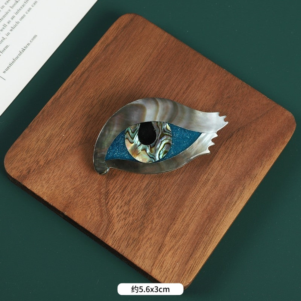 This elegant butterfly brooch is handcrafted from natural mother-of-pearl and iridescent abalone shell, showcasing unique organic patterns. A perfect nature-inspired accessory to elevate any outfit 05