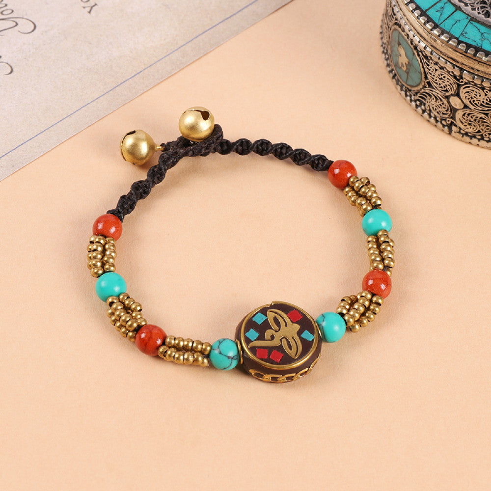 Red-centered beads with turquoise inlays, classic ethnic flair.