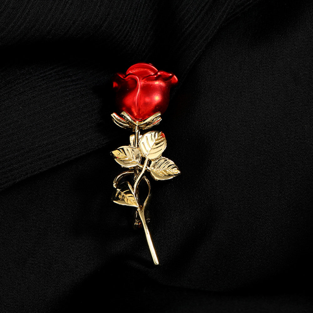 This elegant brooch features vibrant red petals with a lustrous pearl center, set on a gold stem with sparkling crystal accents. A romantic, eye-catching accessory 02