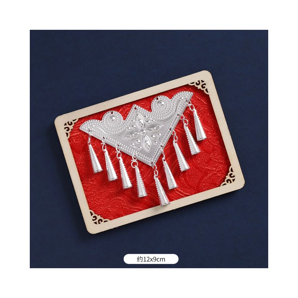 Red geometric fridge magnet with silver tassel accents